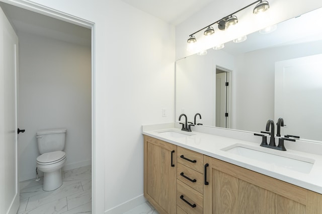 bathroom featuring marble look tiles, baseboards, toilet, and double vanity