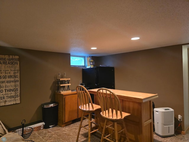 2105 7th St S, Moorhead, MN 56560 - indoor dry bar with freestanding refrigerator, recessed lighting, a textured ceiling, and baseboards