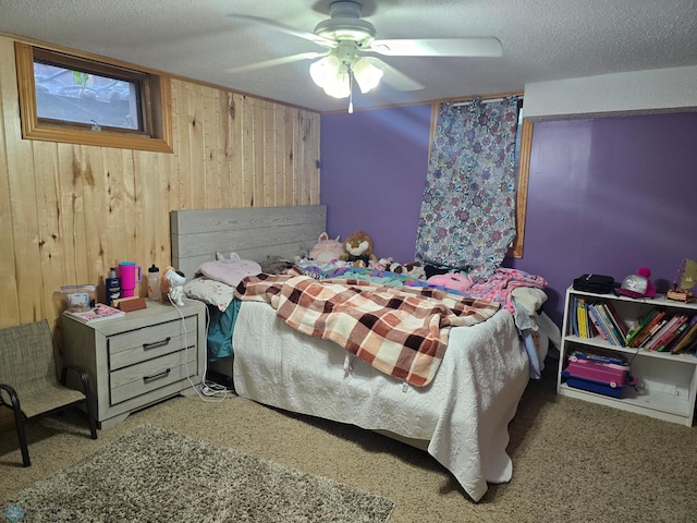 2105 7th St S, Moorhead, MN 56560 - bedroom featuring wood walls, a textured ceiling, and ceiling fan