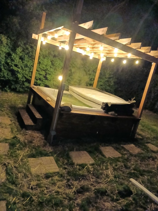 1706 Alcott Ave, Buse Twp, MN 56537 - yard at twilight featuring a pergola