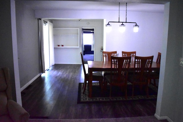 1706 Alcott Ave, Buse Twp, MN 56537 - dining space featuring wood finished floors and baseboards