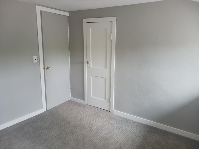 1706 Alcott Ave, Buse Twp, MN 56537 - carpeted empty room featuring baseboards