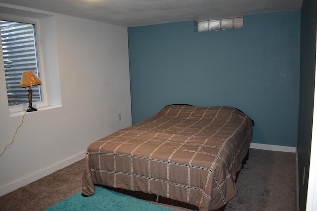 1706 Alcott Ave, Buse Twp, MN 56537 - carpeted bedroom featuring baseboards