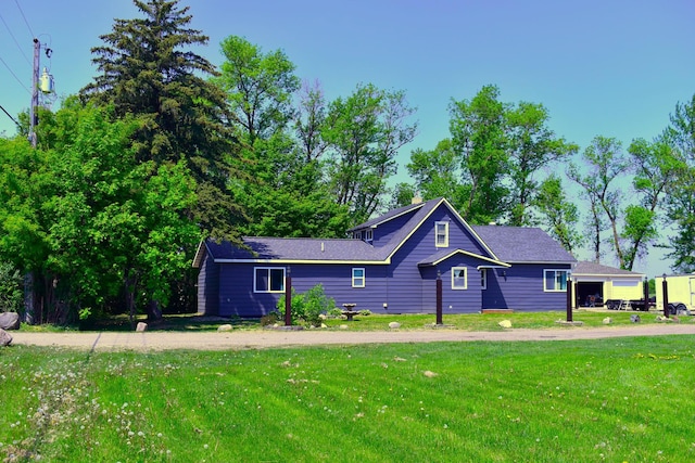 1706 Alcott Ave, Buse Twp, MN 56537 - view of property exterior featuring a lawn
