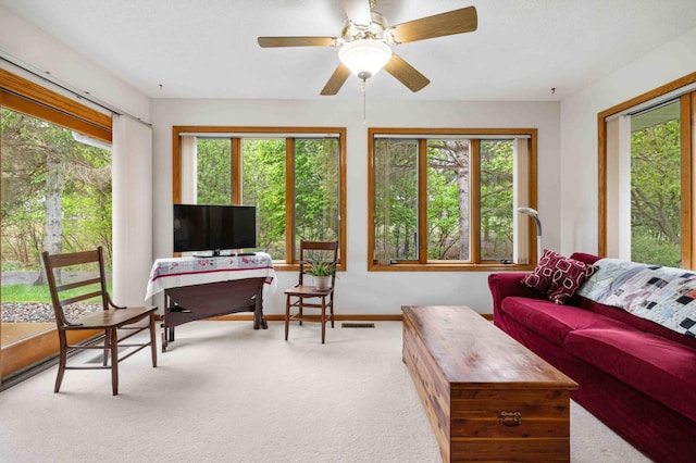 sunroom / solarium featuring healthy amount of natural light