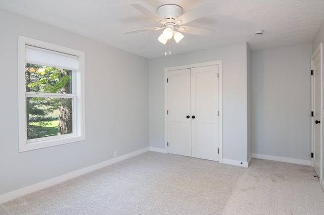504 Wisconsin Ave N, Frederic, WI 54837 - unfurnished bedroom with light carpet, a closet, and baseboards