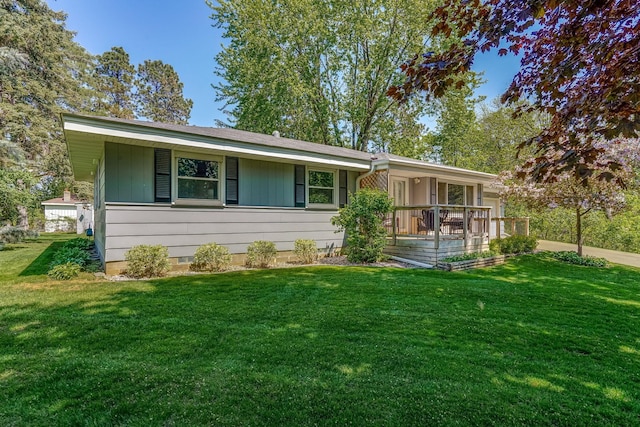 single story home featuring a front yard and a porch