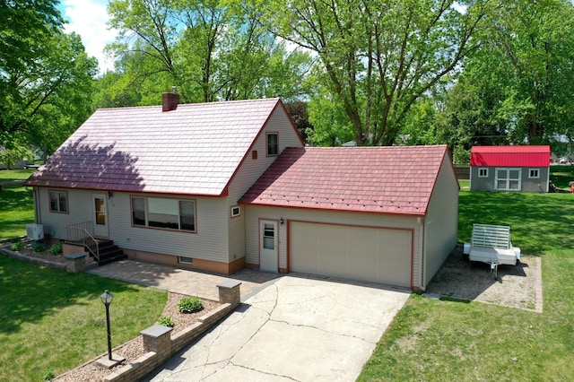 330 1st St W, Lake Lillian, MN 56253 - view of front of property featuring an attached garage, driveway, a chimney, a front yard, and a storage unit