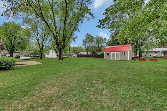 330 1st St W, Lake Lillian, MN 56253 - view of grassy yard with a storage unit and an outbuilding
