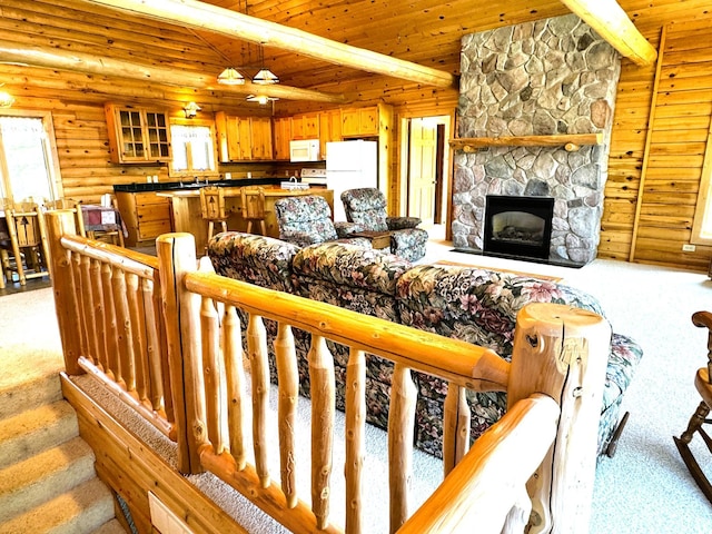 35918 410th Ave SE, Queen Twp, MN 56542 - living area featuring light colored carpet, wooden ceiling, a fireplace, and rustic walls