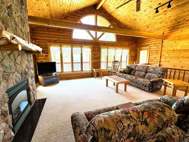 35918 410th Ave SE, Queen Twp, MN 56542 - carpeted living room featuring high vaulted ceiling, track lighting, wood ceiling with exposed beams, and log walls