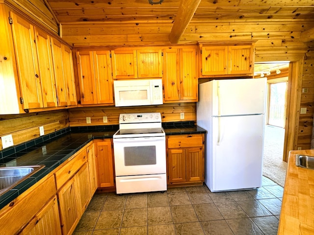35918 410th Ave SE, Queen Twp, MN 56542 - kitchen with white appliances, tile counters, wood ceiling with exposed beams, tasteful backsplash, and dark tile patterned flooring