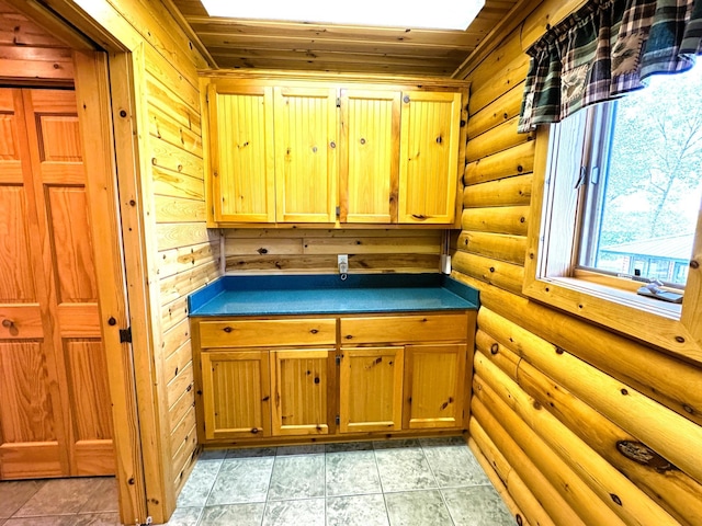 35918 410th Ave SE, Queen Twp, MN 56542 - kitchen with log walls, dark countertops, and wood ceiling