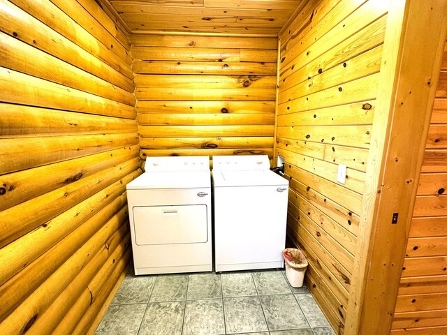 35918 410th Ave SE, Queen Twp, MN 56542 - laundry area with washer and clothes dryer, wood ceiling, and rustic walls