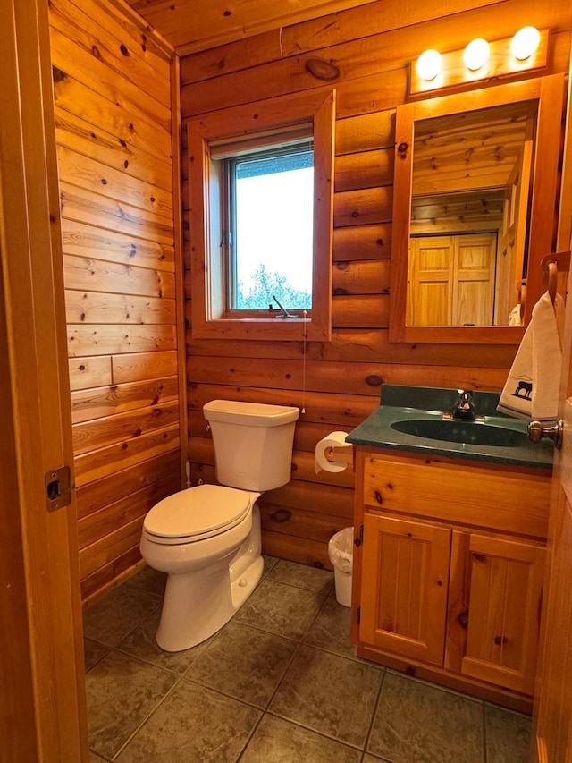 35918 410th Ave SE, Queen Twp, MN 56542 - half bathroom featuring toilet, vanity, log walls, and tile patterned flooring
