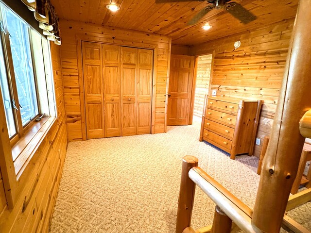 35918 410th Ave SE, Queen Twp, MN 56542 - carpeted bedroom with wooden walls, wood ceiling, recessed lighting, and a closet