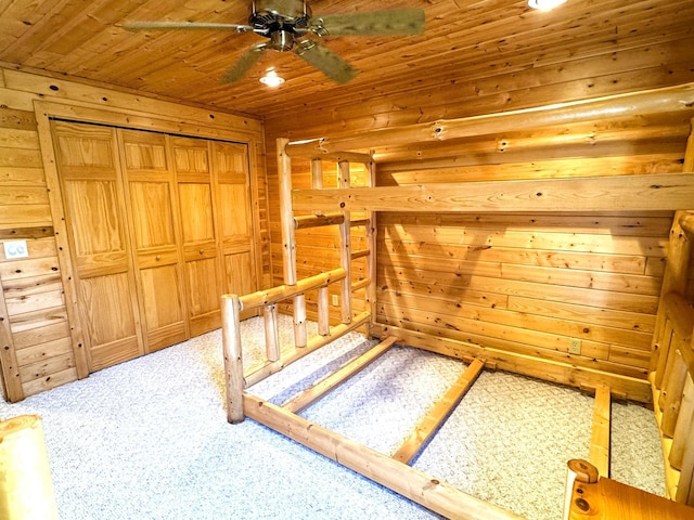 35918 410th Ave SE, Queen Twp, MN 56542 - unfurnished bedroom featuring light colored carpet, wood ceiling, and wood walls