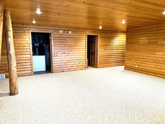 35918 410th Ave SE, Queen Twp, MN 56542 - carpeted empty room featuring log walls, recessed lighting, wood ceiling, and washer / dryer