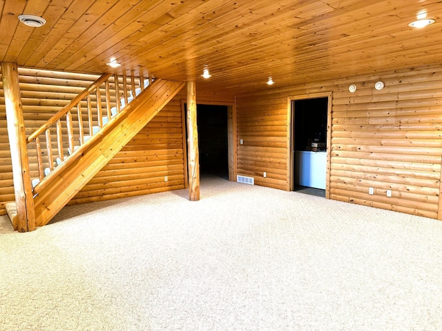 35918 410th Ave SE, Queen Twp, MN 56542 - unfurnished living room featuring rustic walls, carpet floors, stairway, wood ceiling, and recessed lighting