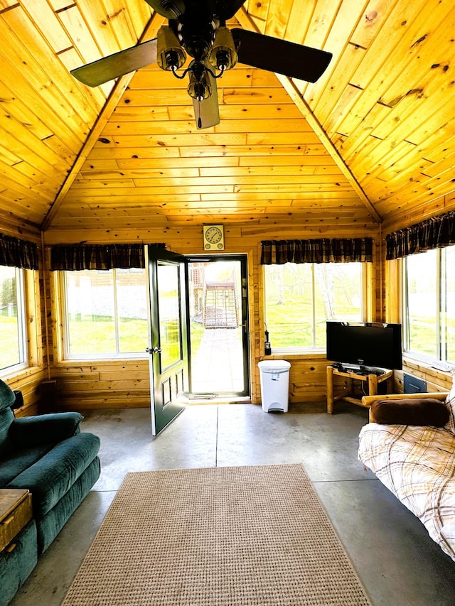 35918 410th Ave SE, Queen Twp, MN 56542 - sunroom with concrete floors, lofted ceiling, healthy amount of natural light, wood ceiling, and wood walls