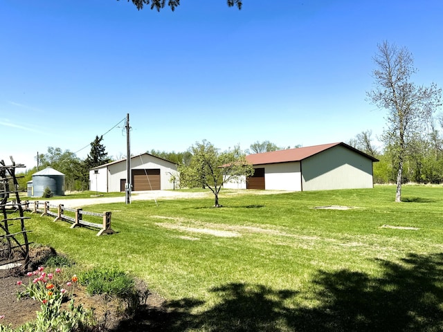 35918 410th Ave SE, Queen Twp, MN 56542 - view of yard with a pole building, a detached garage, and an outdoor structure
