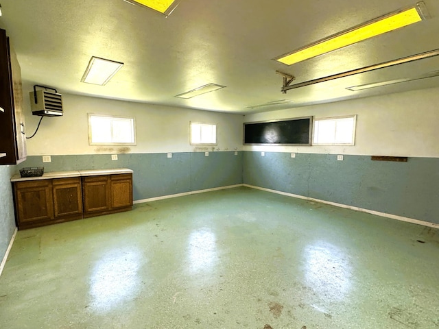 35918 410th Ave SE, Queen Twp, MN 56542 - below grade area featuring baseboards, a heating unit, and a garage