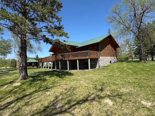 35918 410th Ave SE, Queen Twp, MN 56542 - rear view of house featuring a wooden deck, a yard, and stone siding