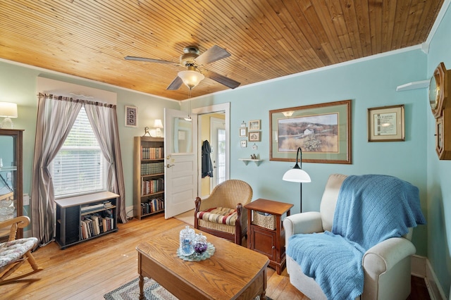 living room with ornamental molding, a ceiling fan, light wood-style floors, and wooden ceiling