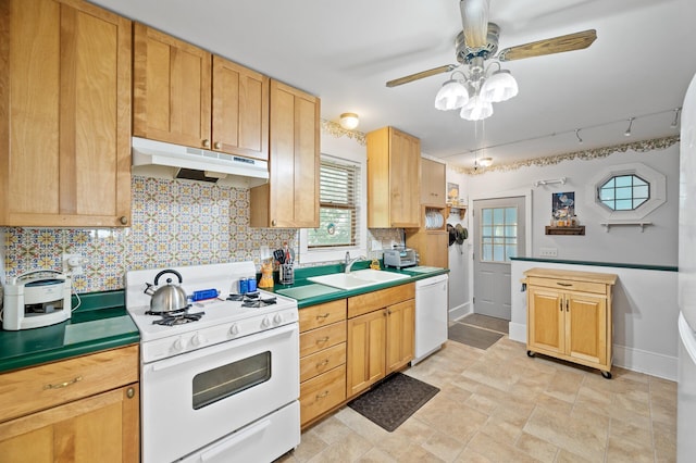 kitchen with under cabinet range hood, white appliances, a sink, ceiling fan, and light countertops
