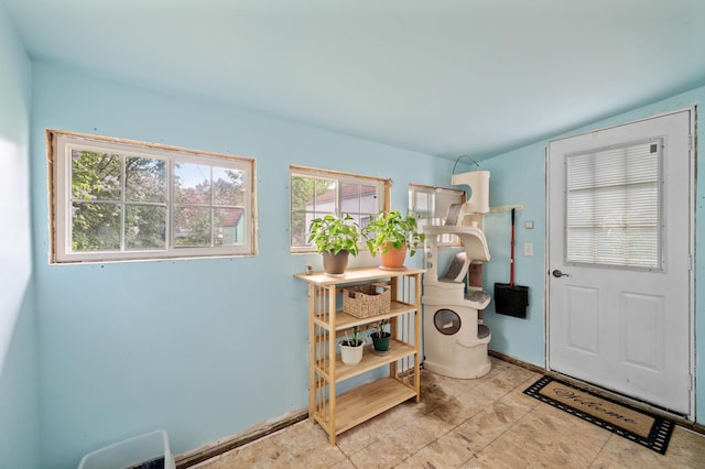 washroom with baseboards