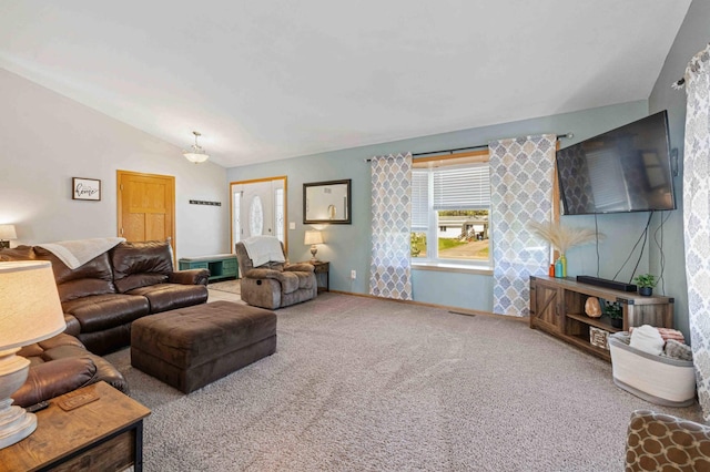 living area featuring vaulted ceiling, carpet floors, and baseboards