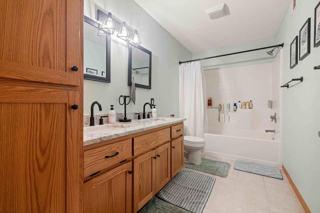 full bath with toilet, tile patterned floors, shower / bath combination with curtain, double vanity, and baseboards
