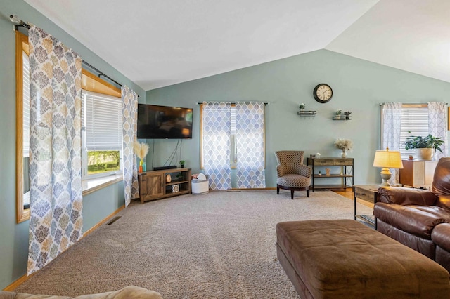 living room featuring vaulted ceiling and carpet flooring