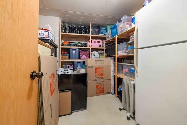 storage area featuring radiator heating unit