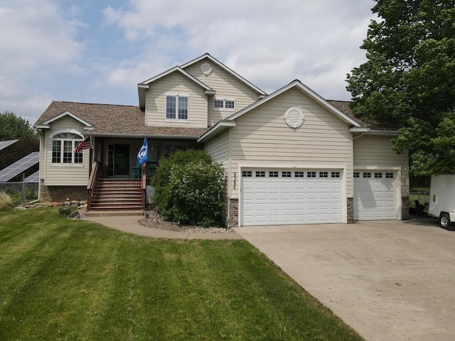 9386 Jennifer Ct, Chisago Lake Twp, MN 55013 - view of front facade with driveway, a front yard, a garage, covered porch, and roof with shingles