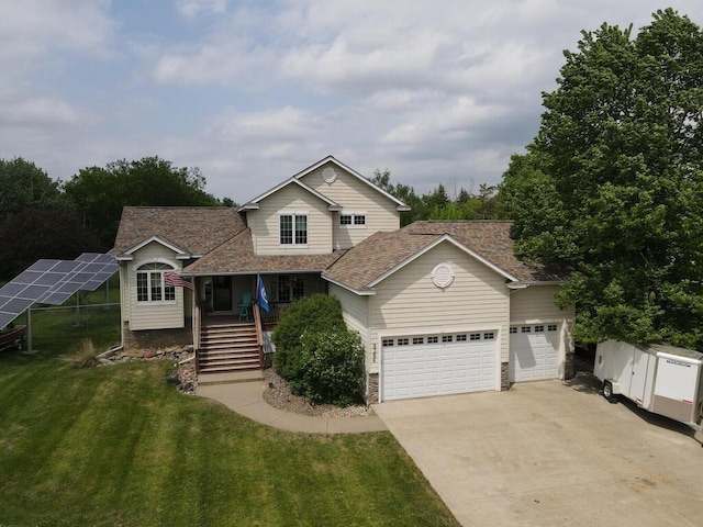 9386 Jennifer Ct, Chisago Lake Twp, MN 55013 - traditional home featuring a garage, concrete driveway, a front yard, stairway, and solar panels