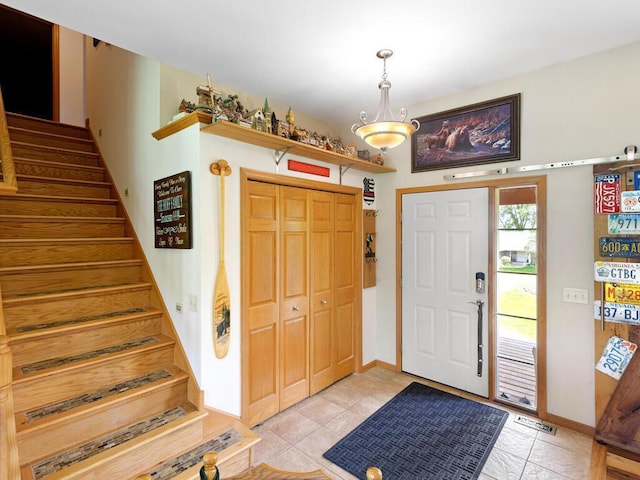 9386 Jennifer Ct, Chisago Lake Twp, MN 55013 - entryway with stairway, baseboards, and light tile patterned floors