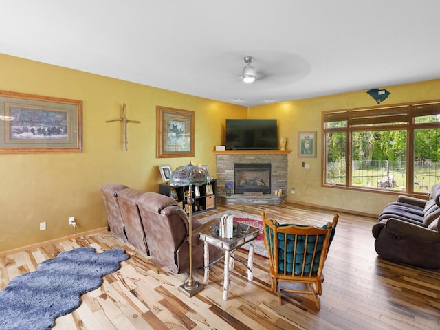 9386 Jennifer Ct, Chisago Lake Twp, MN 55013 - living area featuring a ceiling fan, a fireplace, wood finished floors, and baseboards