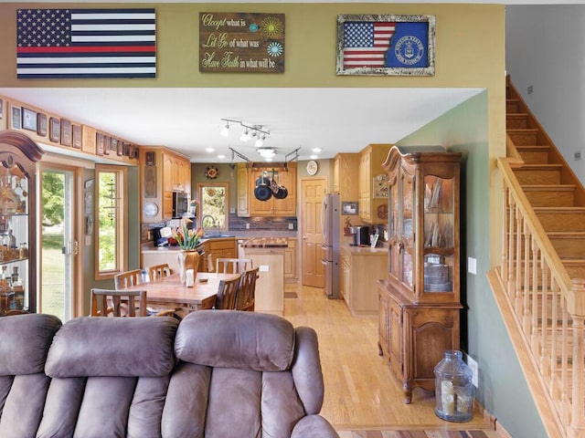 9386 Jennifer Ct, Chisago Lake Twp, MN 55013 - living room featuring stairs and light wood-type flooring
