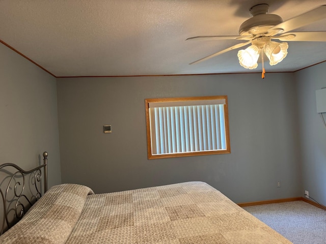 19103 County 4, Henrietta Twp, MN 56470 - carpeted bedroom featuring ornamental molding, ceiling fan, a textured ceiling, and baseboards