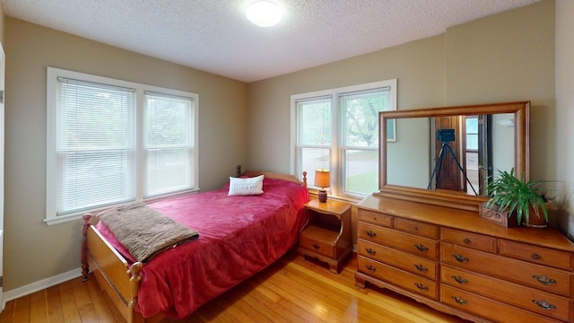 2559 Westview Ter, Hopkins, MN 55305 - bedroom with a textured ceiling and light wood-style floors