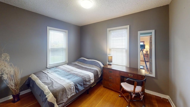 2559 Westview Ter, Hopkins, MN 55305 - bedroom featuring a textured ceiling and light wood-type flooring