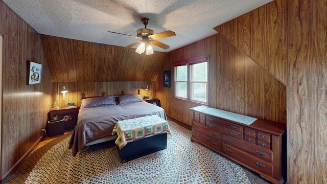2559 Westview Ter, Hopkins, MN 55305 - bedroom with wood walls, vaulted ceiling, a textured ceiling, and ceiling fan