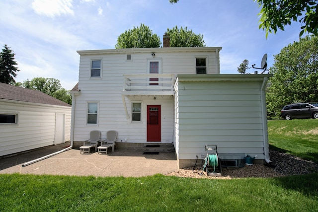 2559 Westview Ter, Hopkins, MN 55305 - rear view of property with a chimney, a lawn, a patio, and entry steps