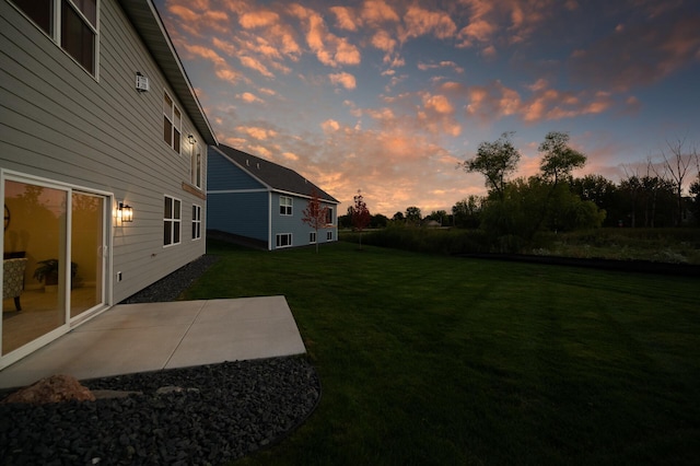 20105 Glenbrook Path, Lakeville, MN 55044 - yard at dusk featuring a yard and a patio