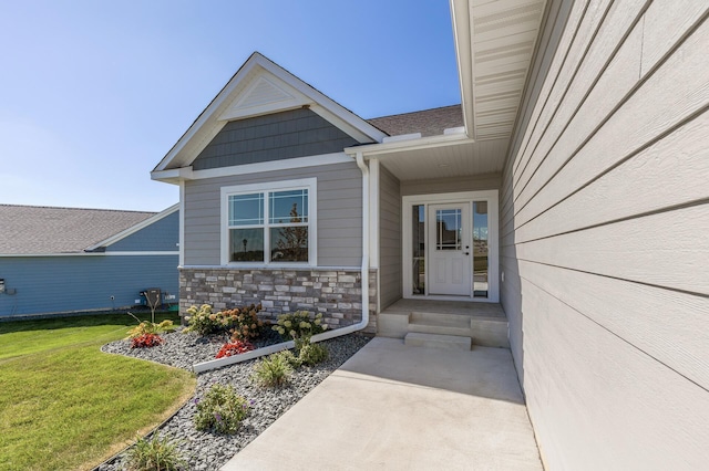 20105 Glenbrook Path, Lakeville, MN 55044 - view of exterior entry featuring a lawn and stone siding