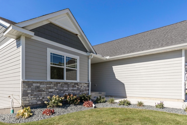 20105 Glenbrook Path, Lakeville, MN 55044 - entrance to property featuring a shingled roof, stone siding, and a yard