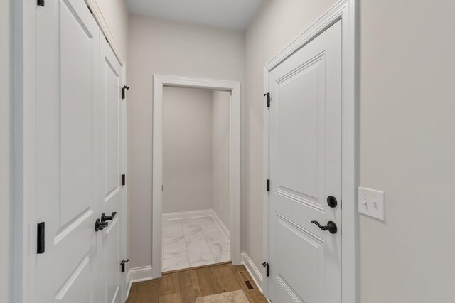 20105 Glenbrook Path, Lakeville, MN 55044 - doorway to outside featuring baseboards and light marble finish floors