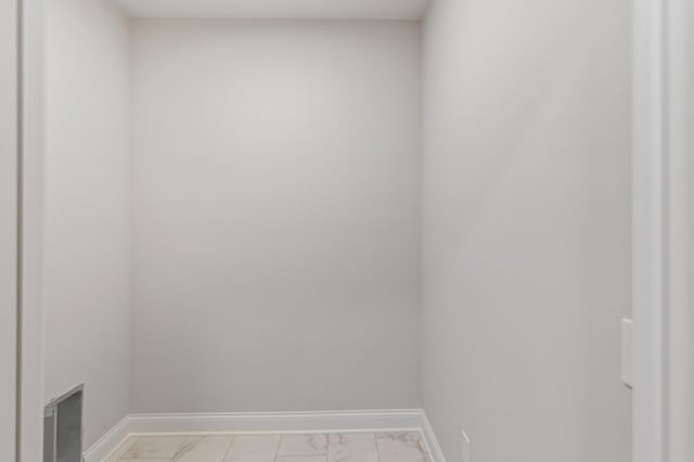 20105 Glenbrook Path, Lakeville, MN 55044 - laundry room with light marble finish floors and baseboards