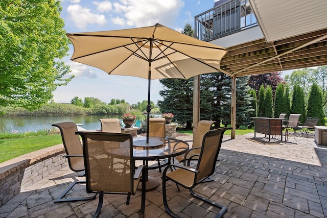 12187 Dunkirk St NE, Blaine, MN 55449 - view of patio / terrace featuring outdoor dining space, a balcony, and a water view